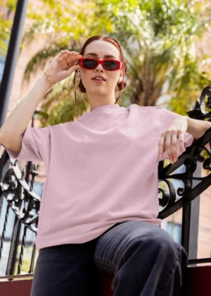 Woman in oversized Light Baby Pink t-shirt – soft cotton tee from Befiqr Style’s minimal fashion collection