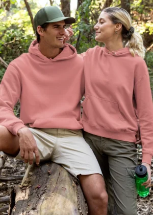 Coral solid color hoodie worn by male and female models, 300 GSM cotton fleece unisex streetwear style, Befiqr Style